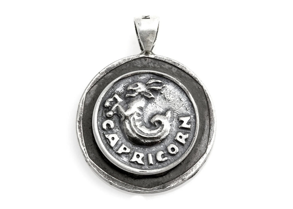 Handcrafted sterling silver Capricorn necklace featuring an authentic Old Israeli 10 Sheqel coin by Noa Tam.