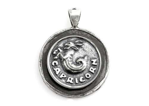 Handcrafted sterling silver Capricorn necklace featuring an authentic Old Israeli 10 Sheqel coin by Noa Tam.