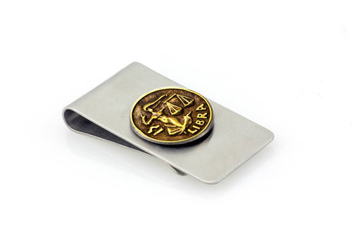 Libra zodiac brass medallion mounted on a stainless steel money clip.