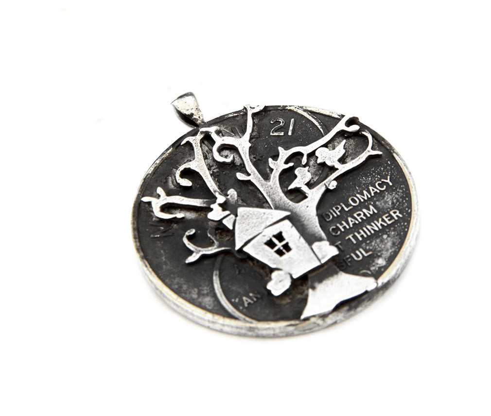 Silver Gemini pendant along with tree and birds