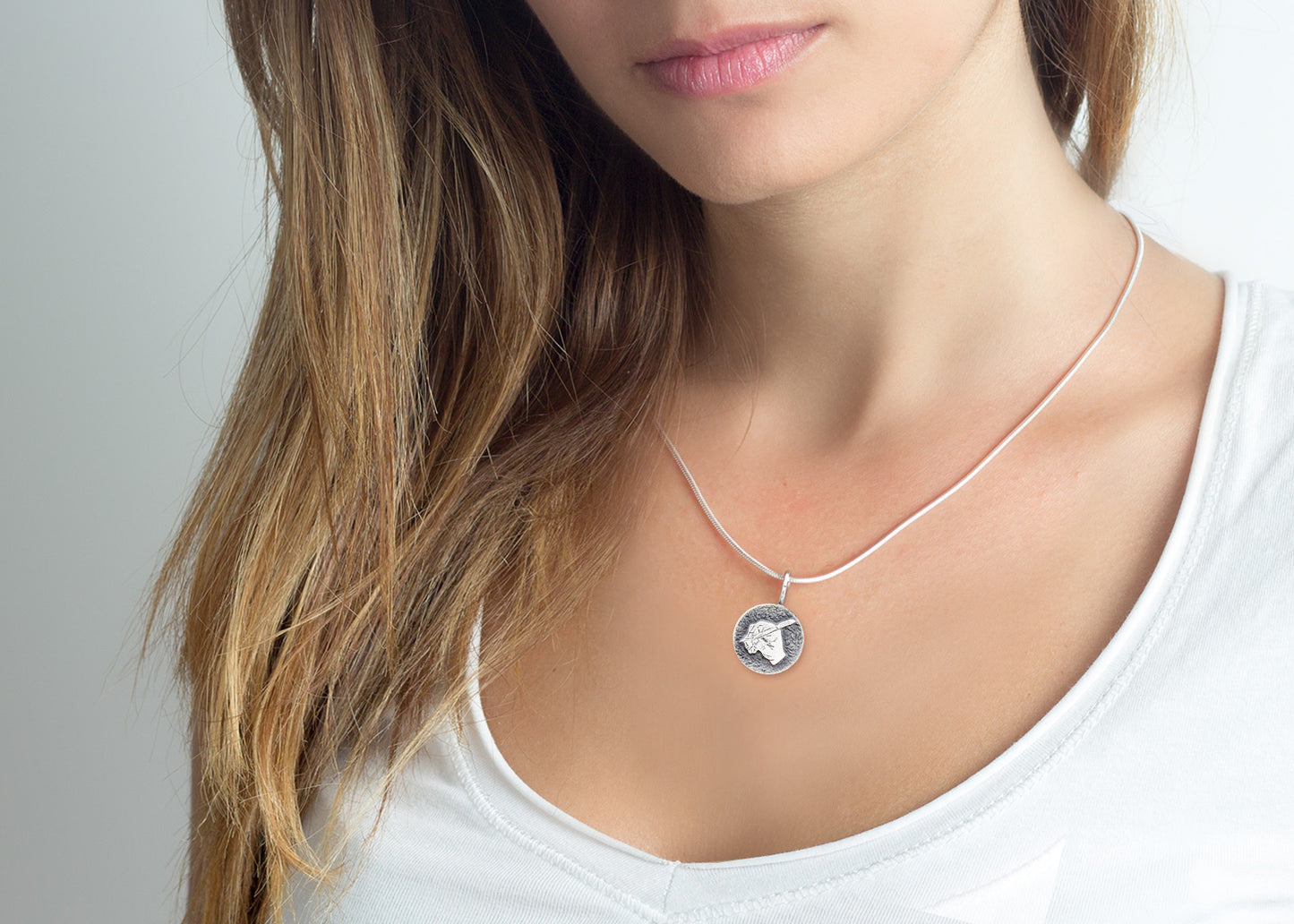 An amazing medallion necklace with the  The writing hand coin medallion